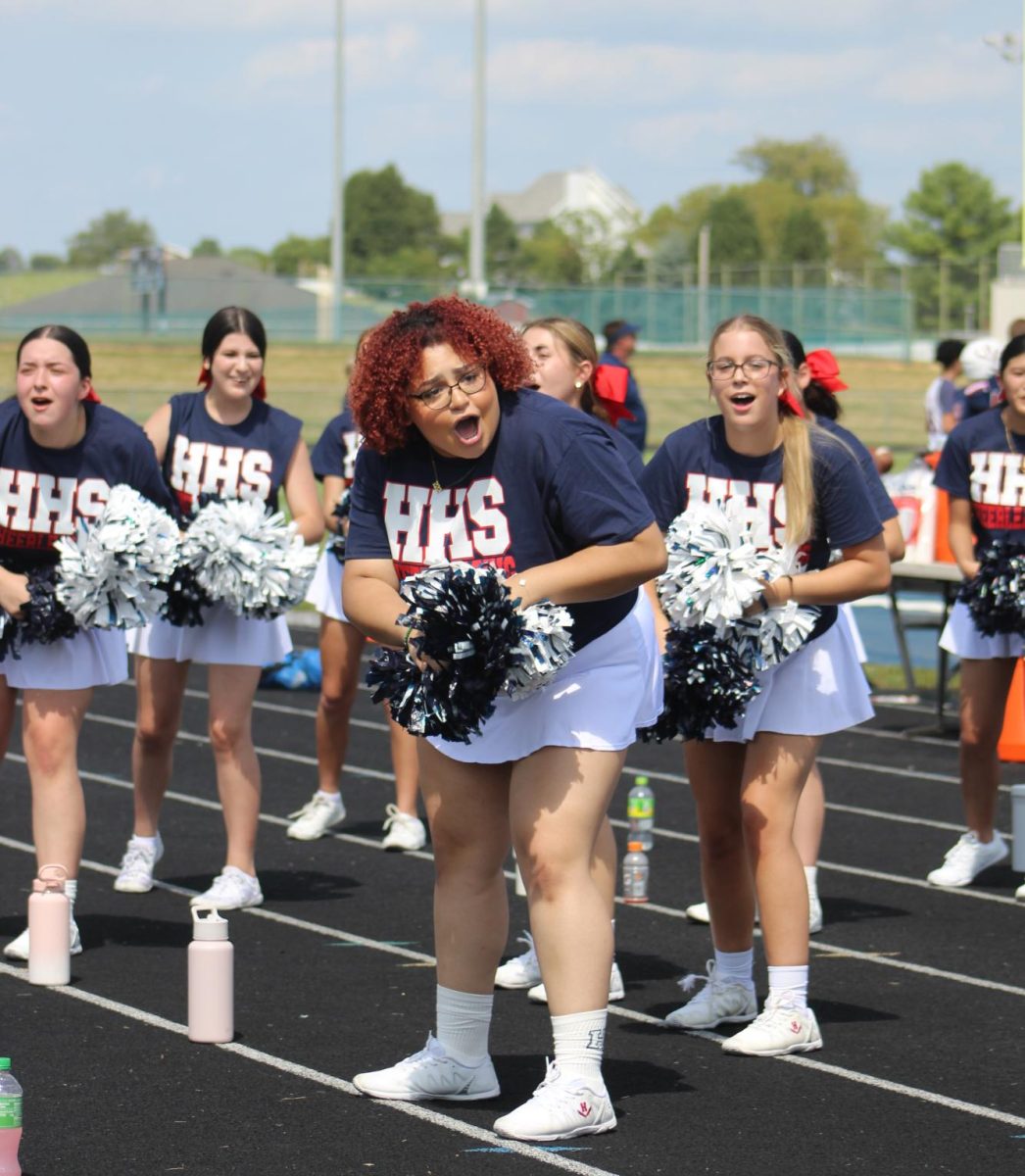 Sideline cheer performs bluestreak rumble