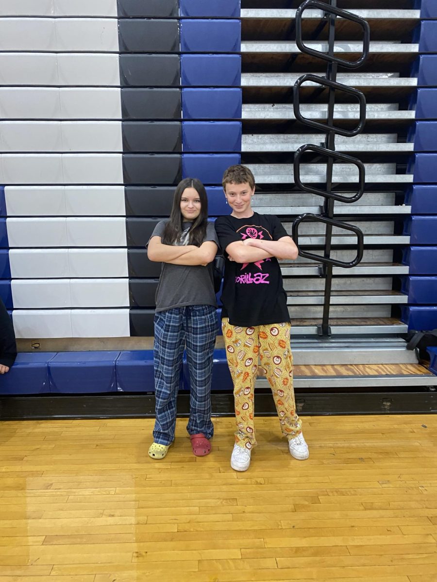 Freshmen Lily Bartley and Elliot Norment striking a pose while wearing their pajamas.