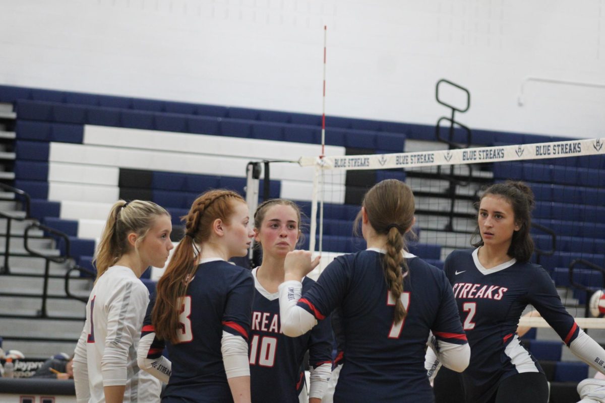 Players discuss what to do for the next play.