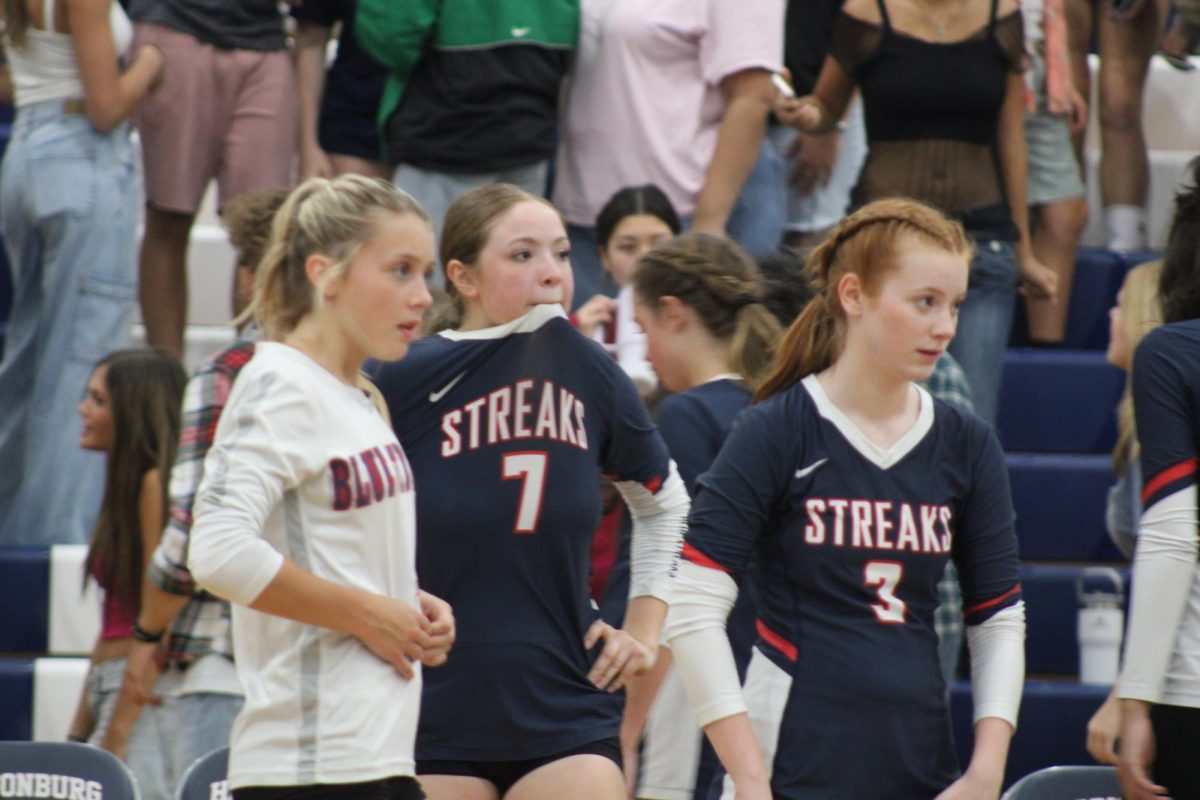 Juniors Teagen Miller, Veronica Guiterrez, and Aubree Ringwald awaiting the next play.