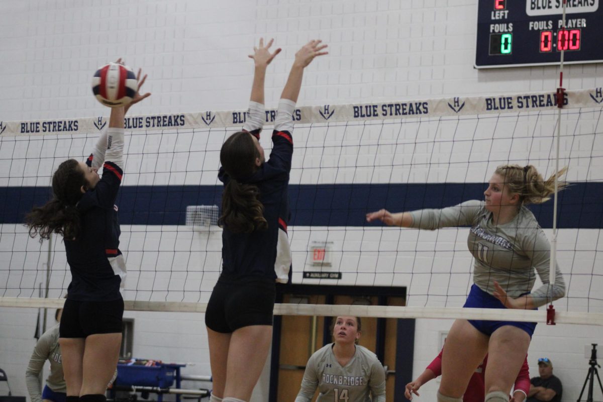 Junior Autumn Sinnett and Freshman Nora Von Rotz blocking the opposing attacker.