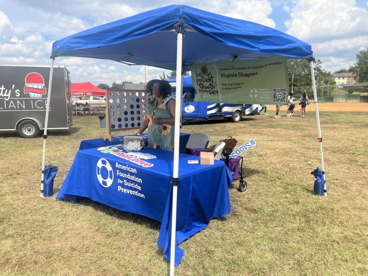 Markita Madden, a program manager for the American Foundation for Suicide Prevention is hosting a table at the African-American festival to talk to community members.