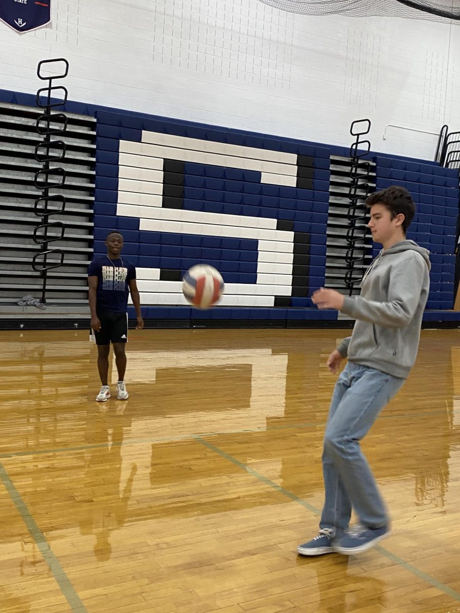 Freshman Ethan Jenkins passes the ball with a friend.