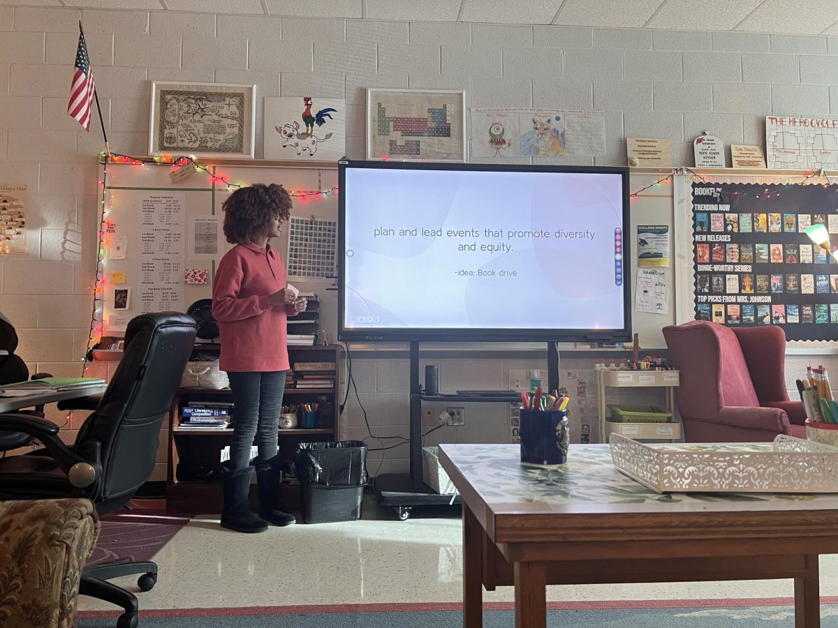 Diversity Equity Ambassadors Club President senior Waluse Chauda presents a presentation including information about what the club is about and its goals.