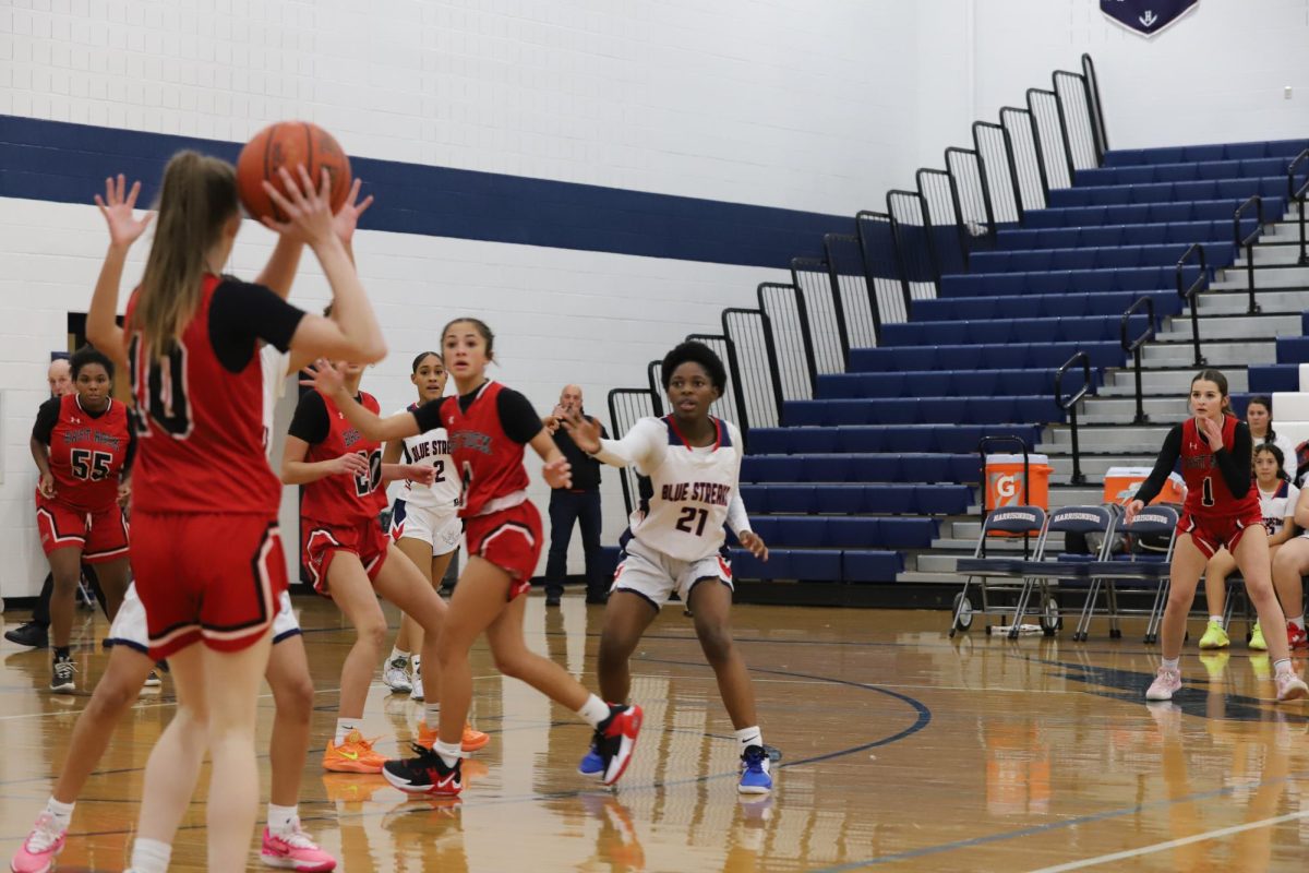 Sophomore Mariah Etienne gets blocked by the other player. 