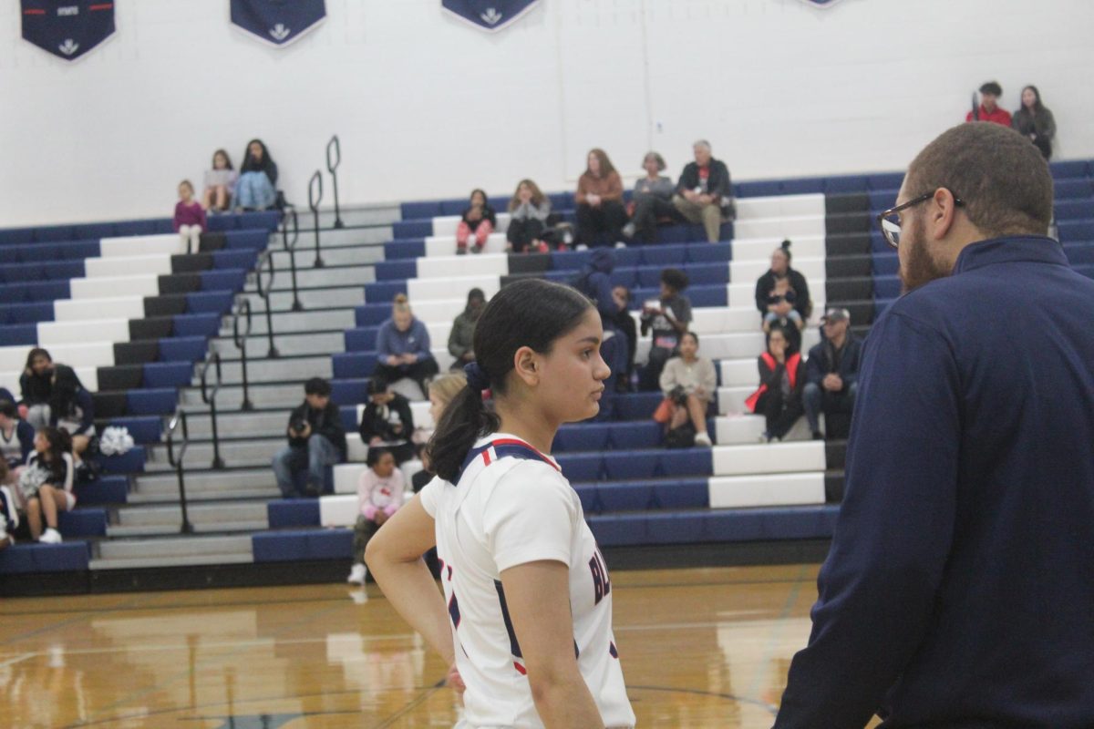 Sophomore Lopez Mejia Giovanna  Gatting directions from her coach.