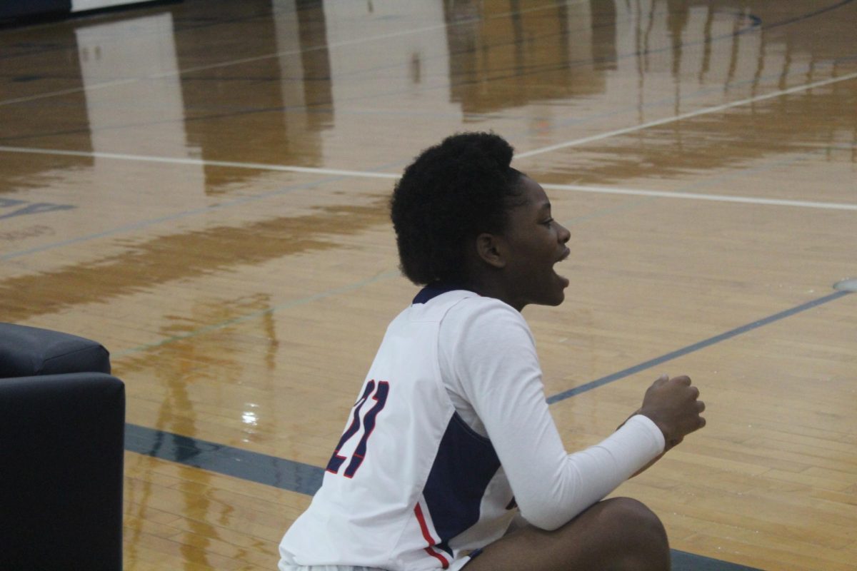  Sophomore Etienne Mariah cheering her team up before swapping with another player of her team.