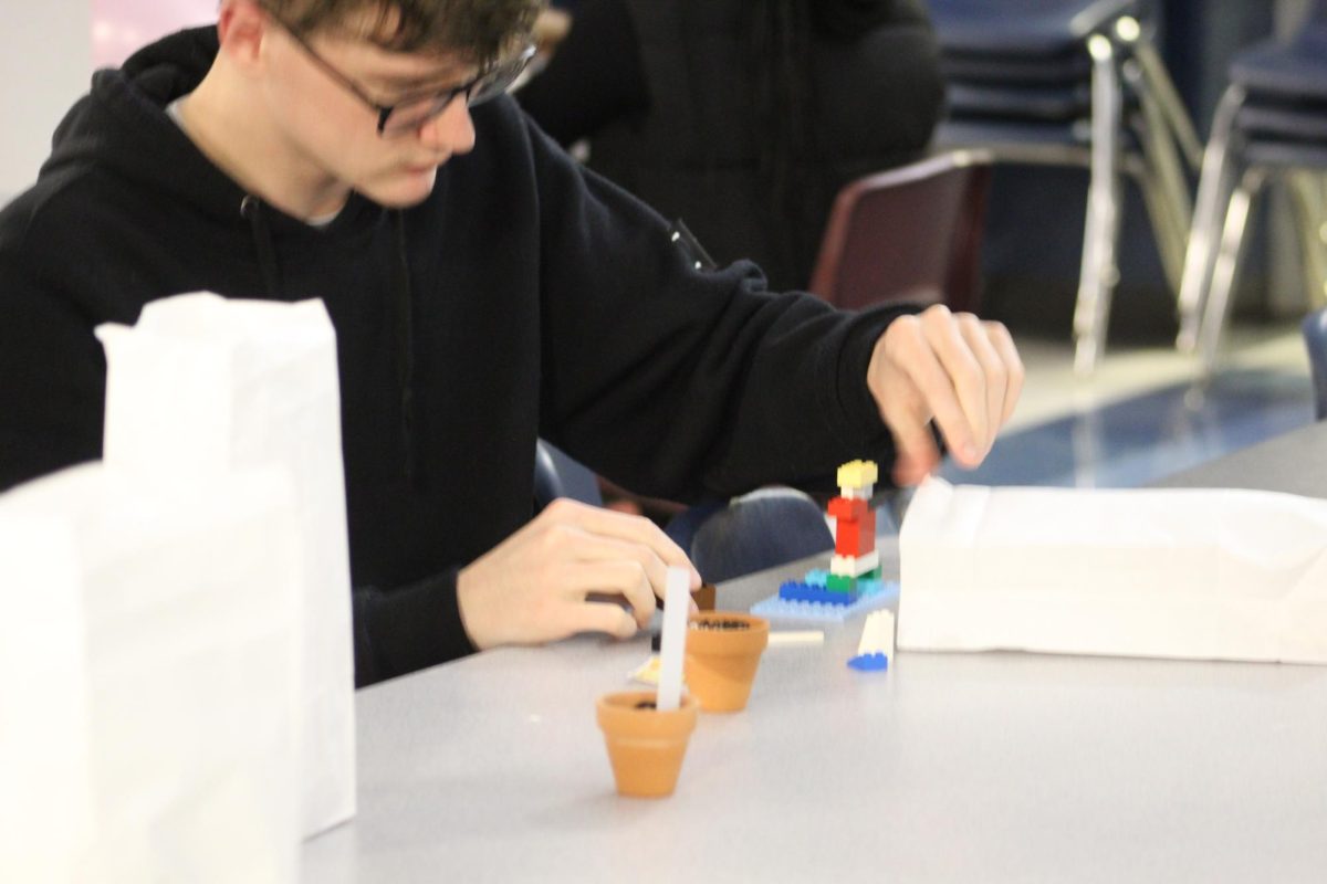 Student builds with legos at STEM night.