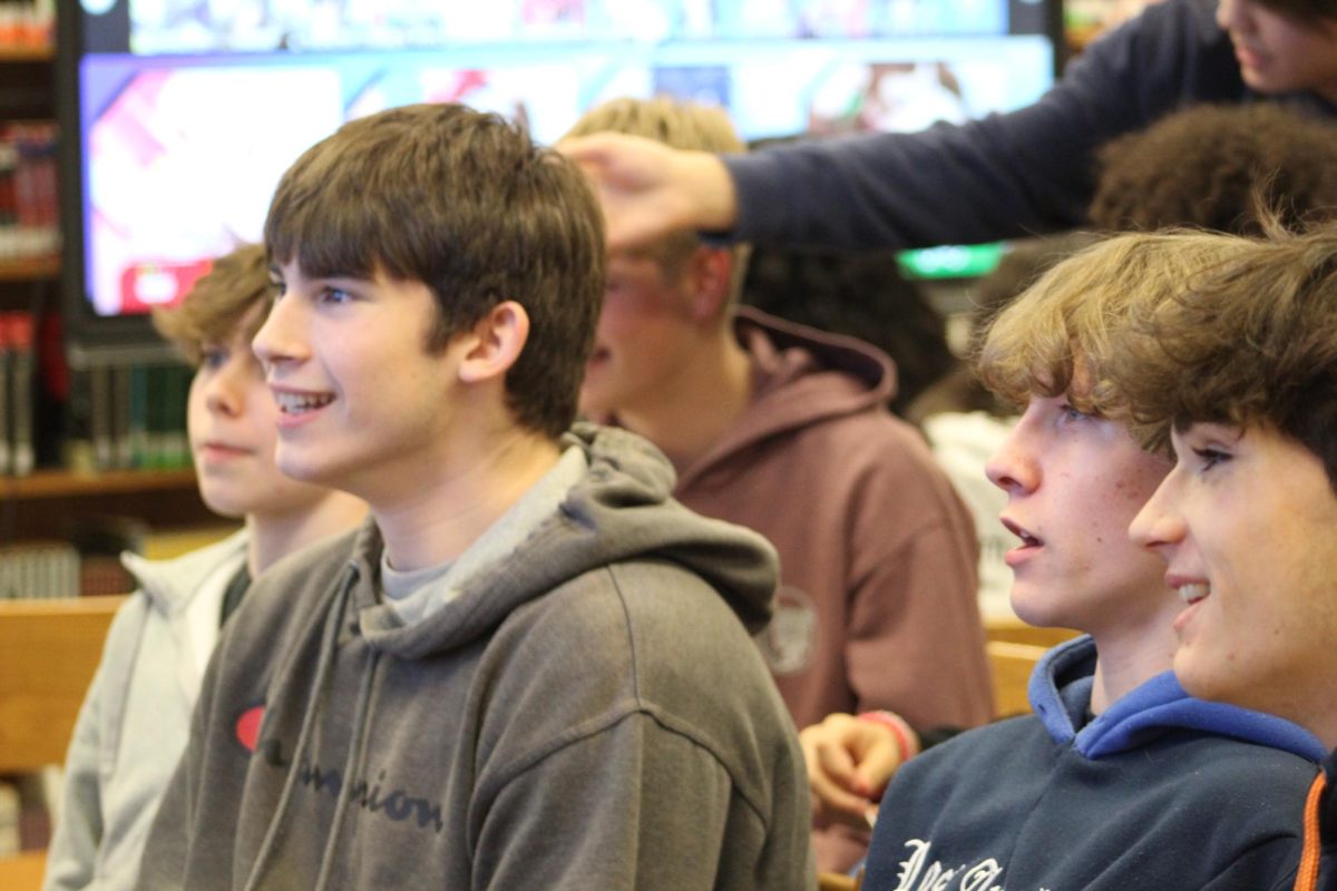 Students play video games at the STEM night.