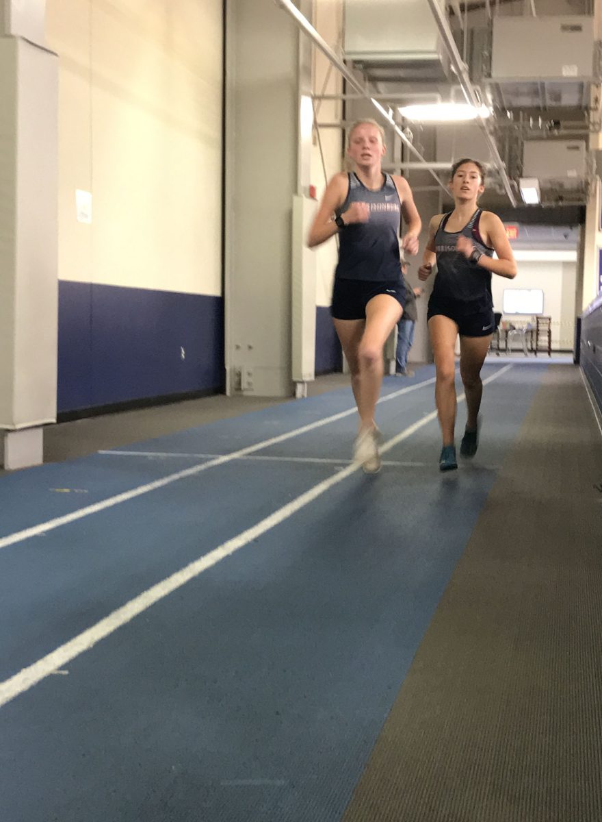Senior Lena Blagg and Sophomore Sophie Kauffman running the mile.