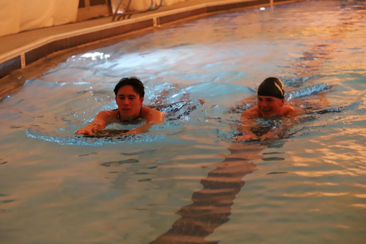 Senior Julien Steines and Junior Paul Tongen swim their 100 kick warm up together. 