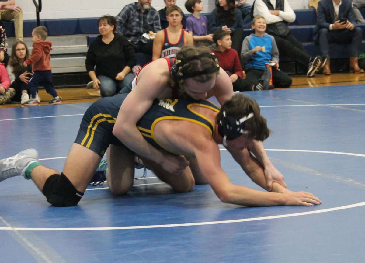 Senior Charlie Blair III grabs his opponents wrist during a break down.