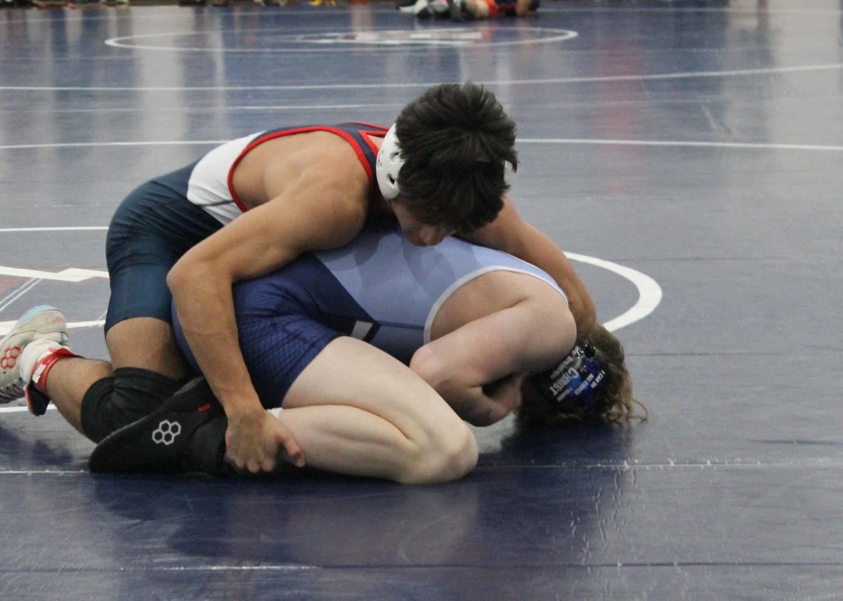 Freshman Jeriel Herrera attempts to get control of his opponents leg after a break down.