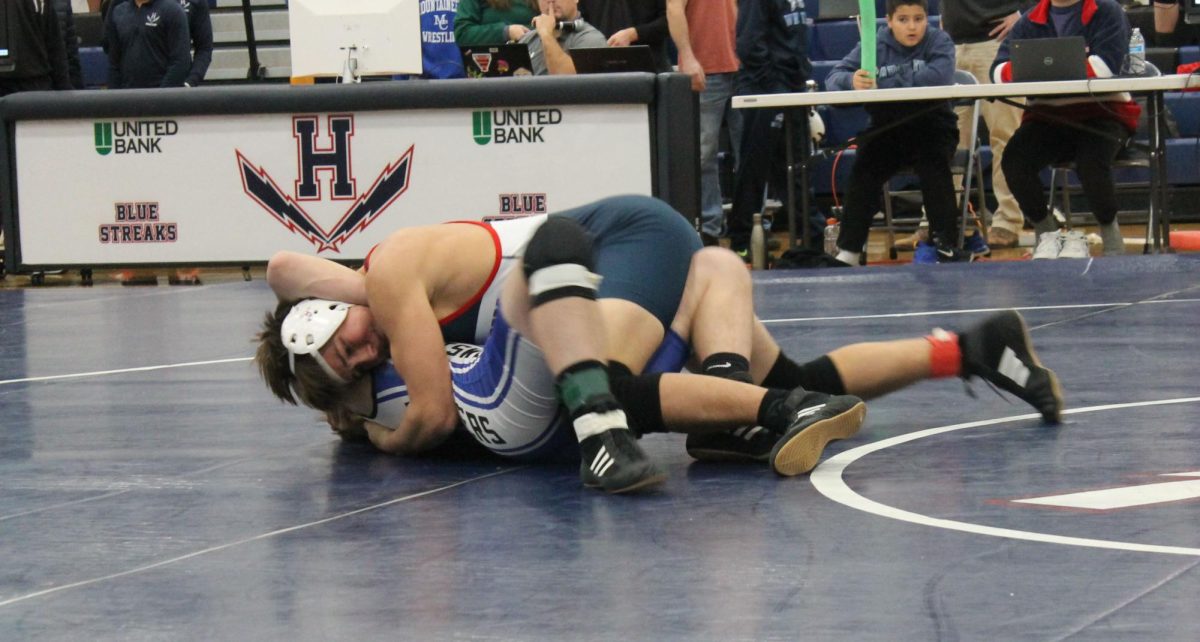 Senior Samuel Katykhin gets the pin in his round of 16 match against Spotswood. Katykhin got third in his weight class.