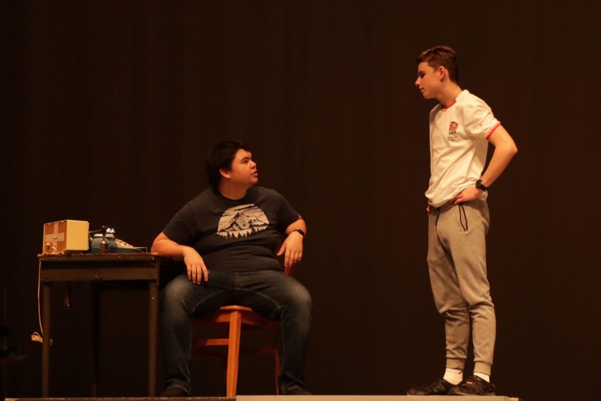 Junior Louis Gibson stares down on the Major during one act rehearsal.