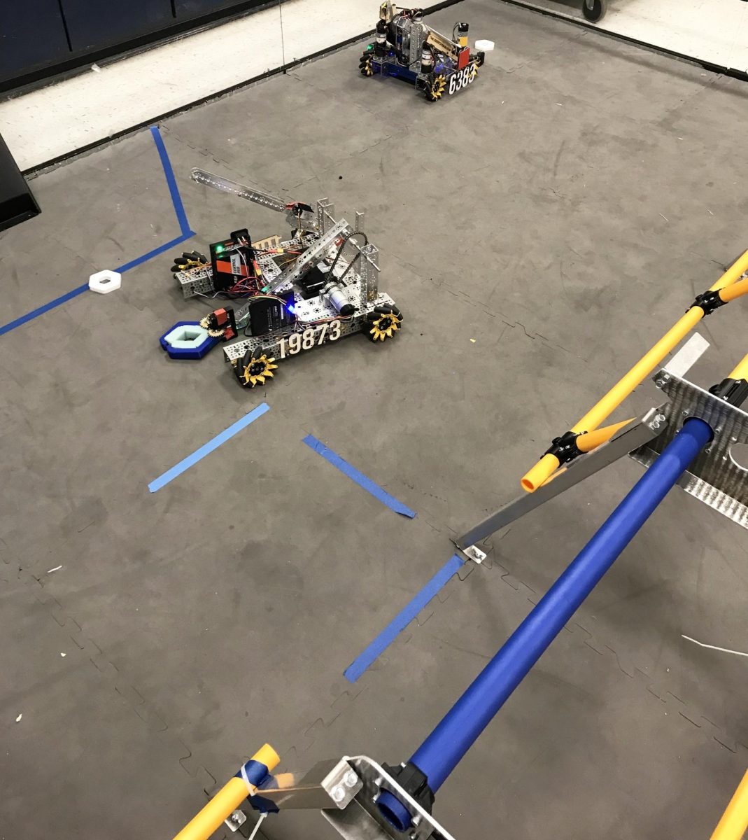 Team 6383 and Team 19873's robots on the field.