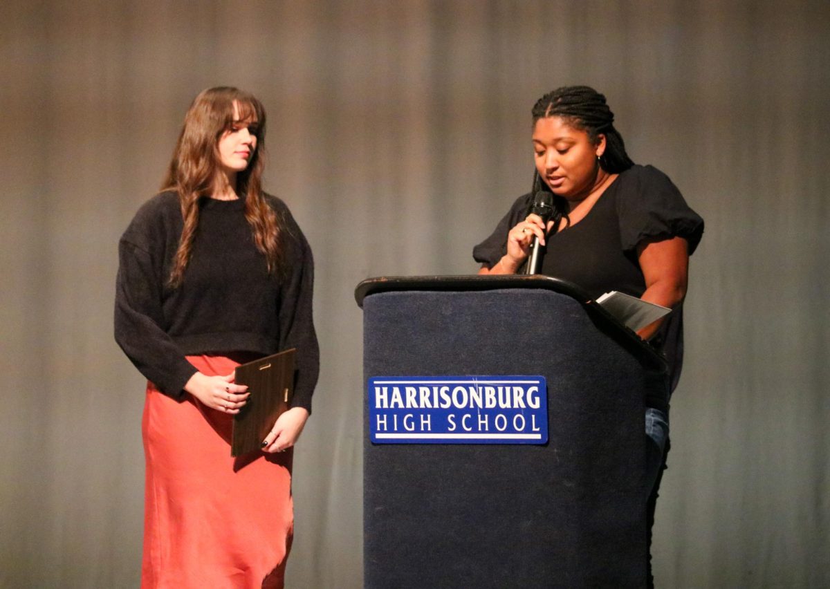 Junior Varsity volleyball coach coach Alexa Weeks introduces and award she is going to give to one of her athletes. 