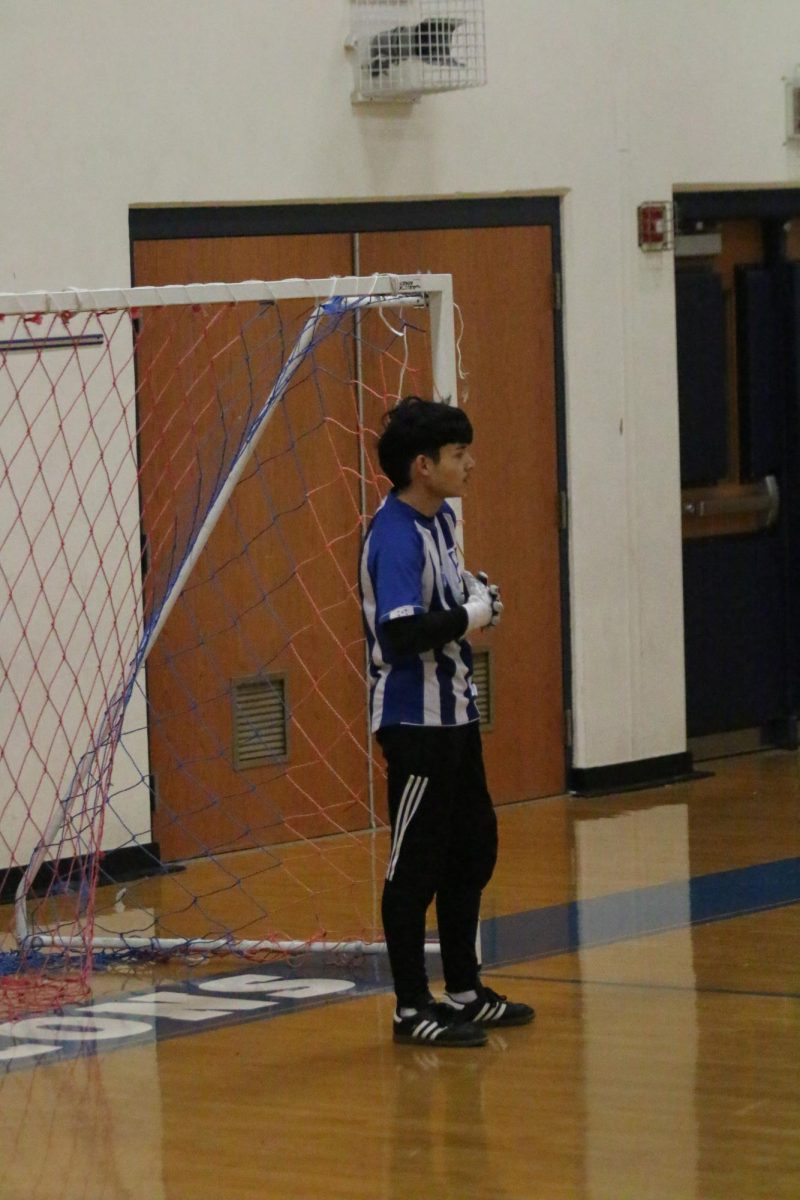 Junior Adolfo Rivera protects the goal from strikers.