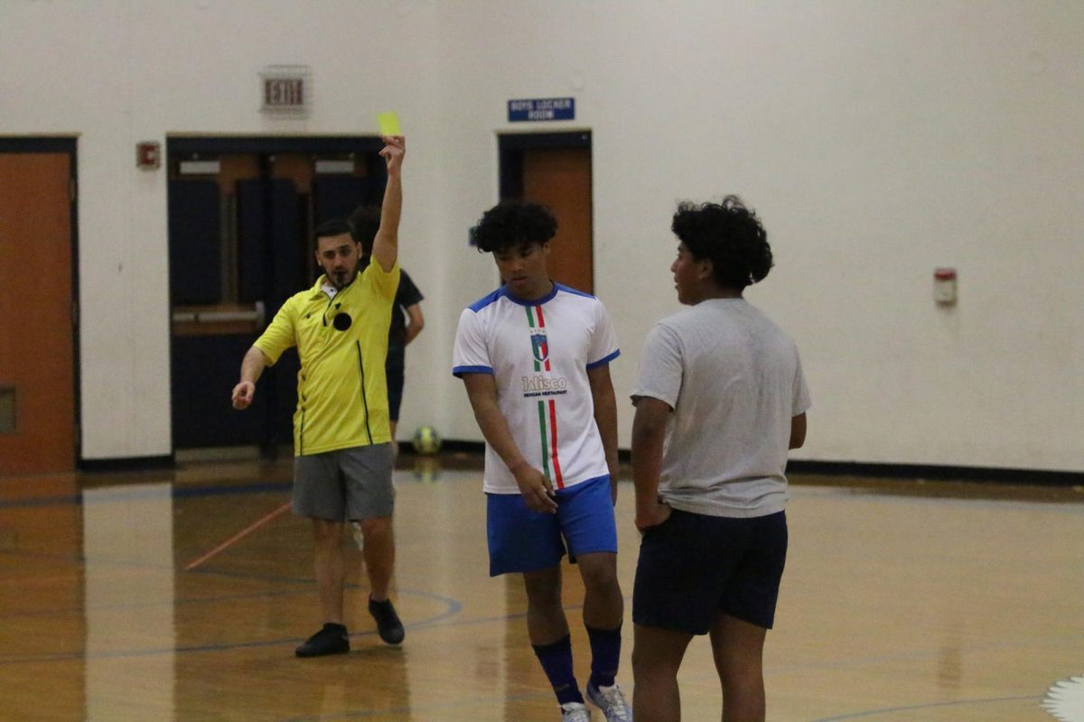 Senior Rodger Vasquez receives a yellow card.