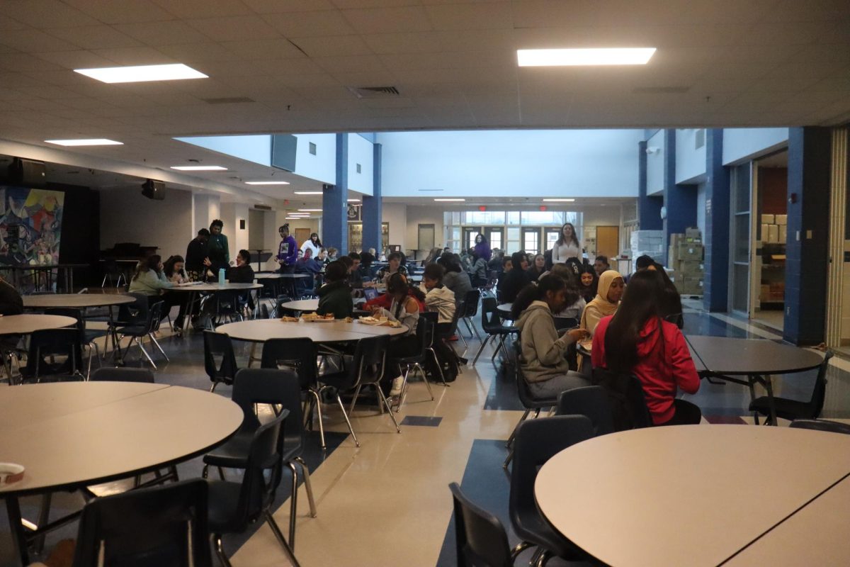 The right side of the cafeteria near the gym, enjoying lunch.