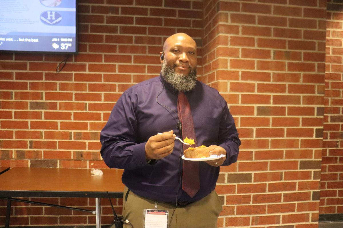 Dean of Students, Durmount Perry eating lunch while he was on lunch duty.