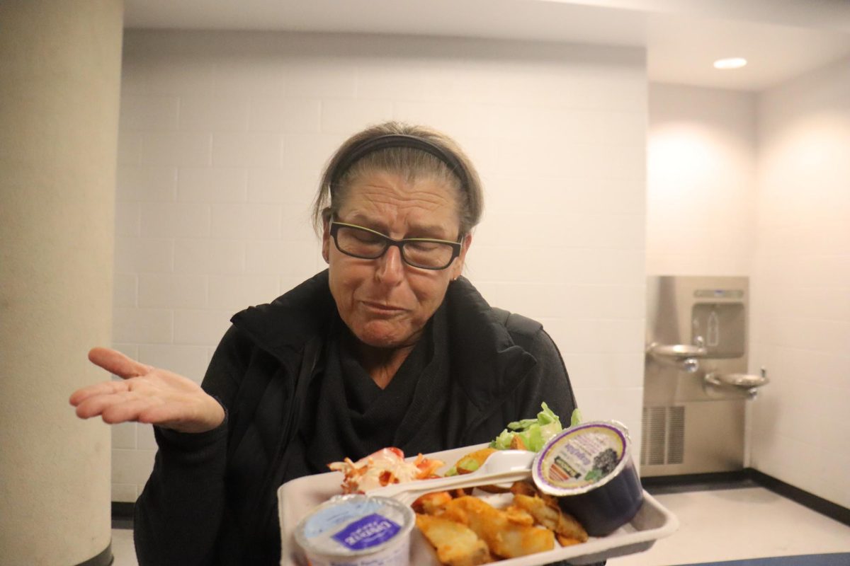 HHS staff showing off her food option.