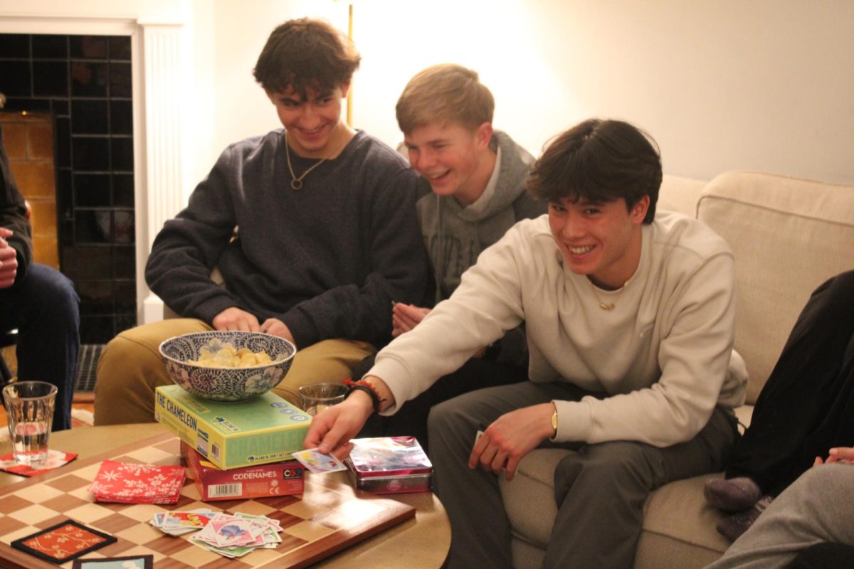 Senior Julien Steines, junior Paul Tongen, and sophomore Albert Krashenninikov laugh at a joke. 