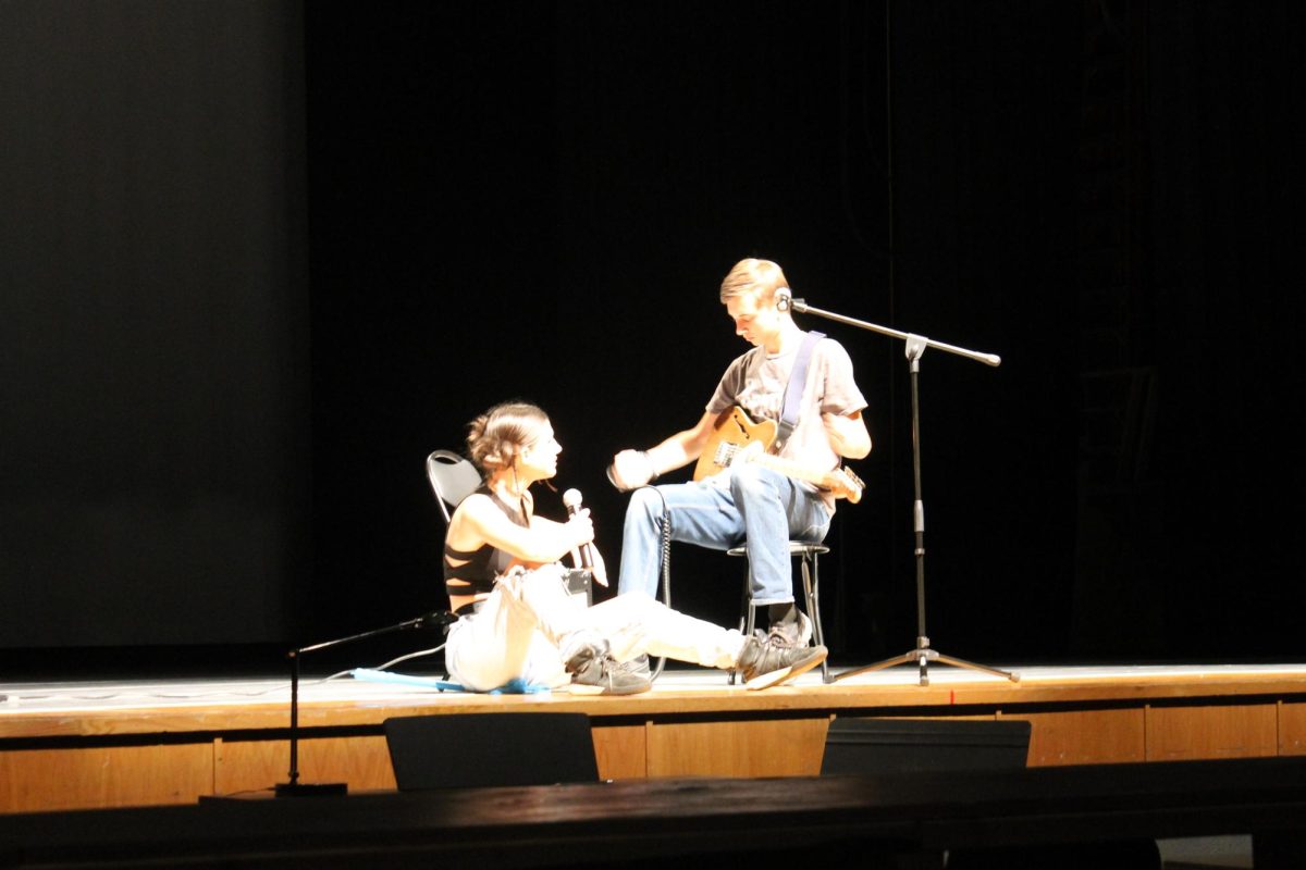 Junior Lila Hostetler and Donovan Eanes sing their son entitle "Flight of inspiration" 