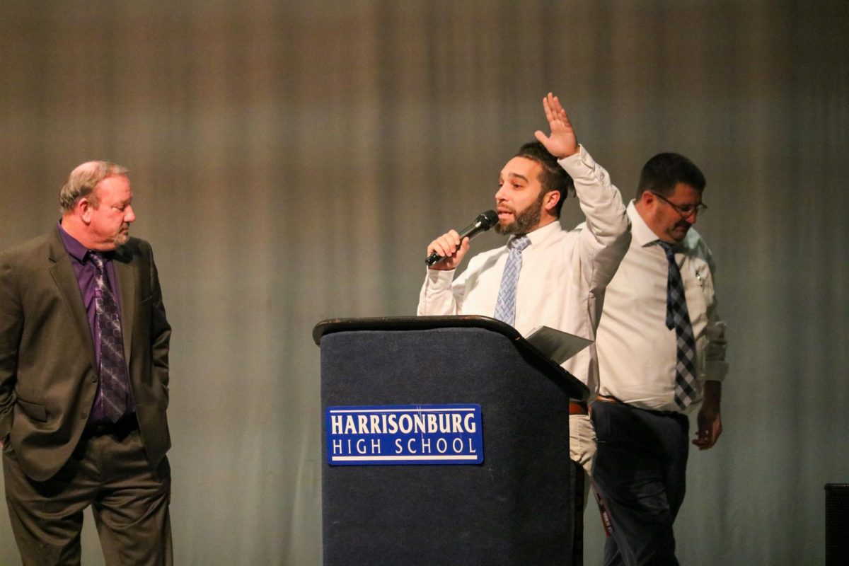 Junior Varsity coach Chris Sorber speaks to the audience during the fall sports awards. 
