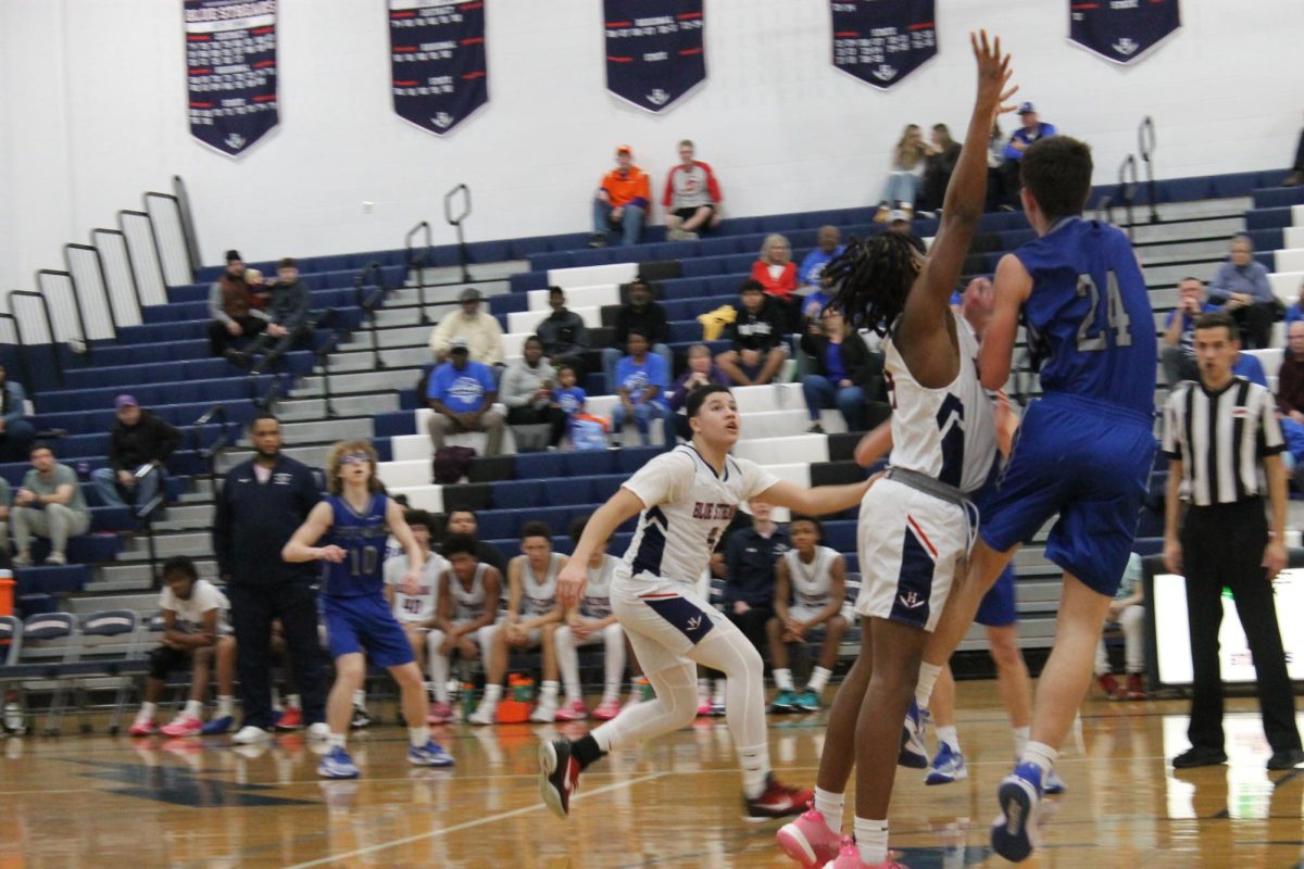 Freshman Maleak Jones attempts to retrieve  the ball. 