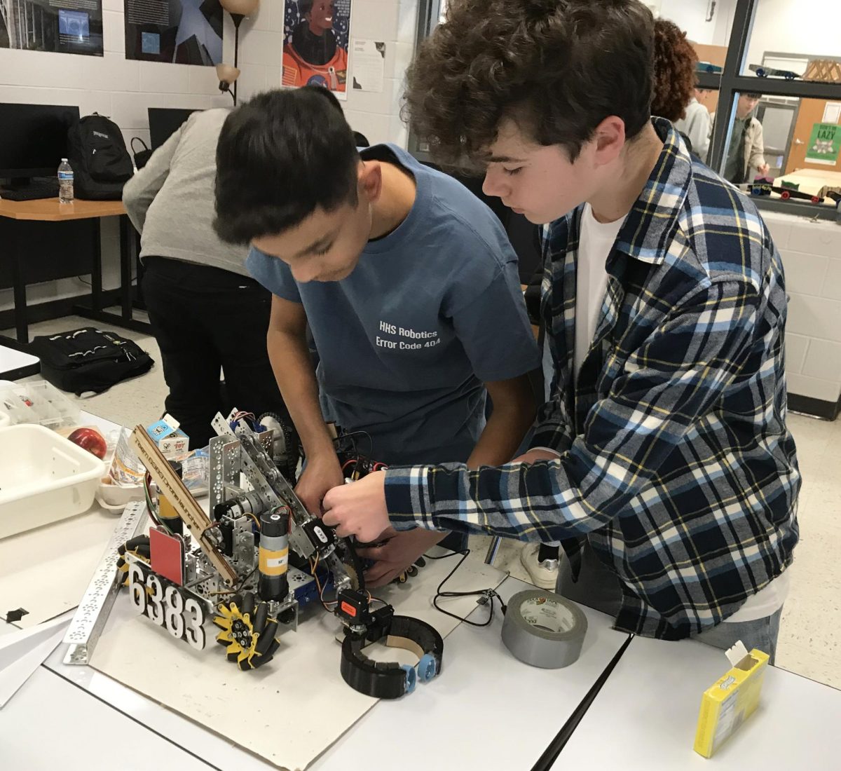 Samuel Walton and Eliel Cortina working on their team's robot.