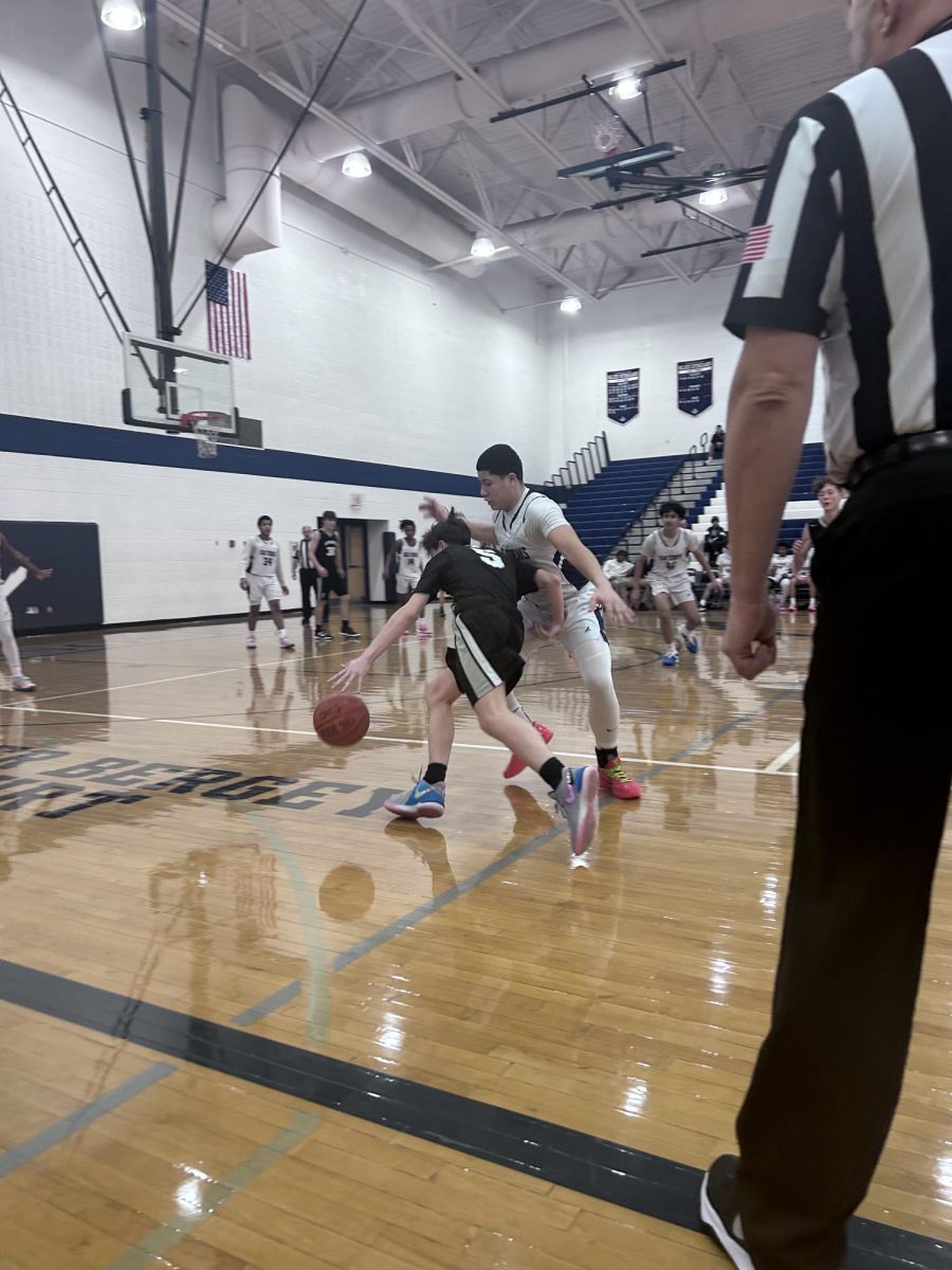 Freshman Yandel Robles blocks a member of the opponent team. 