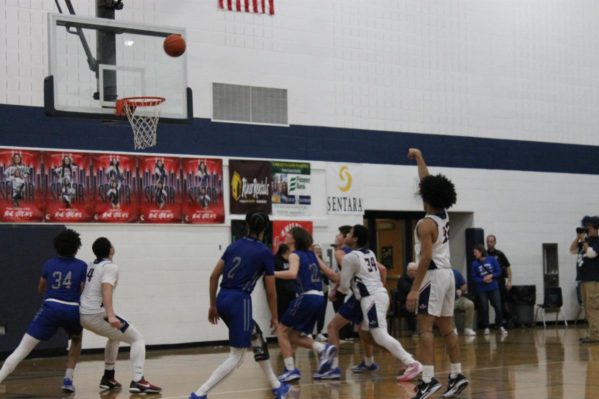 Sophomore Troy Gordon successfully makes the ball in the basket. 