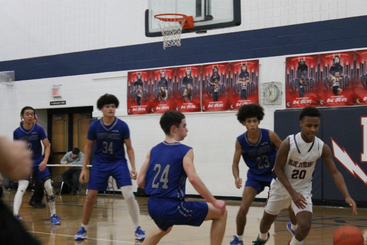 Freshman Keyon Benton attempts to retrieve the ball. 