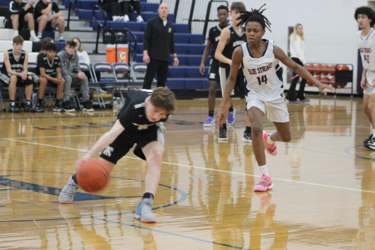 Sophomore Malek Jones runs to retrieve the ball. 