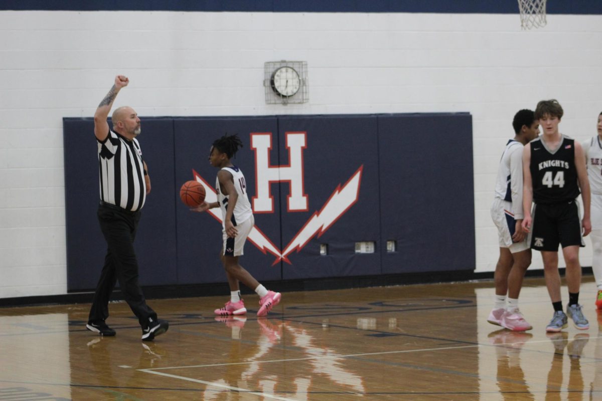 Sophomore Malek Jones prepares to pass the ball to his team.