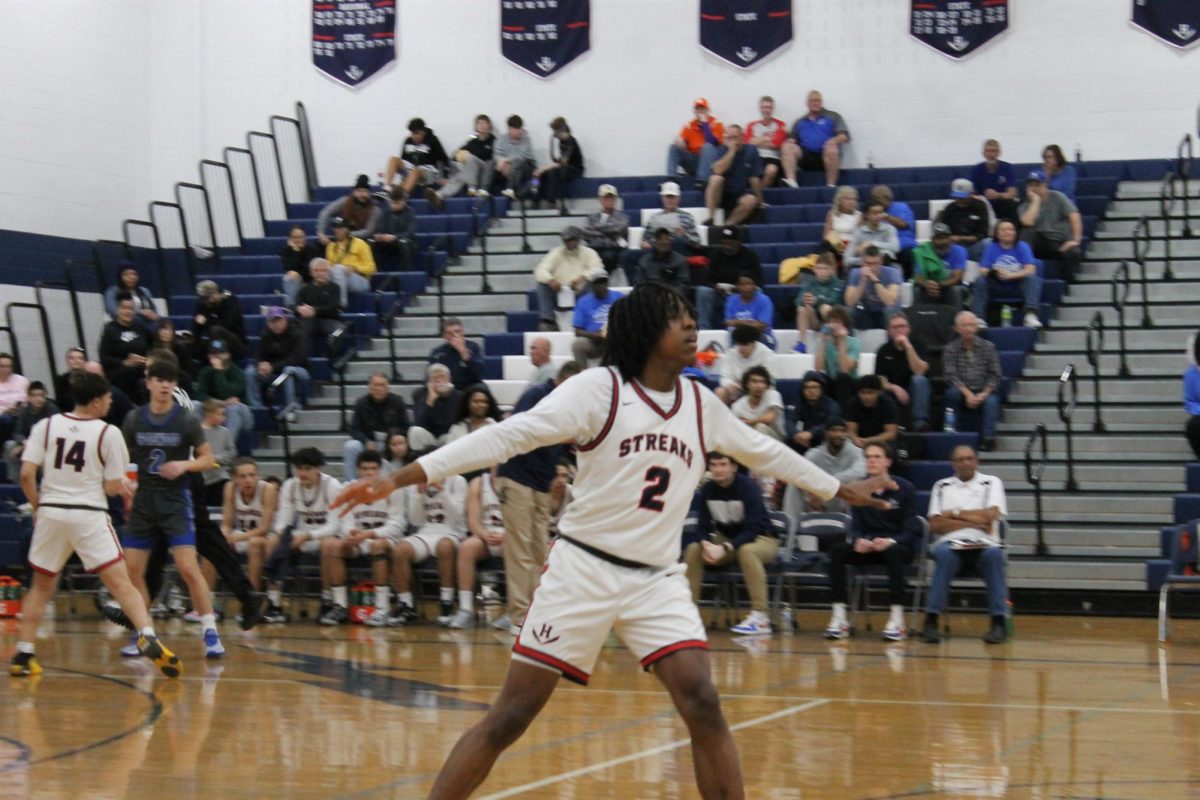 Junior Tiberius Fields remains open to receive the ball. 
