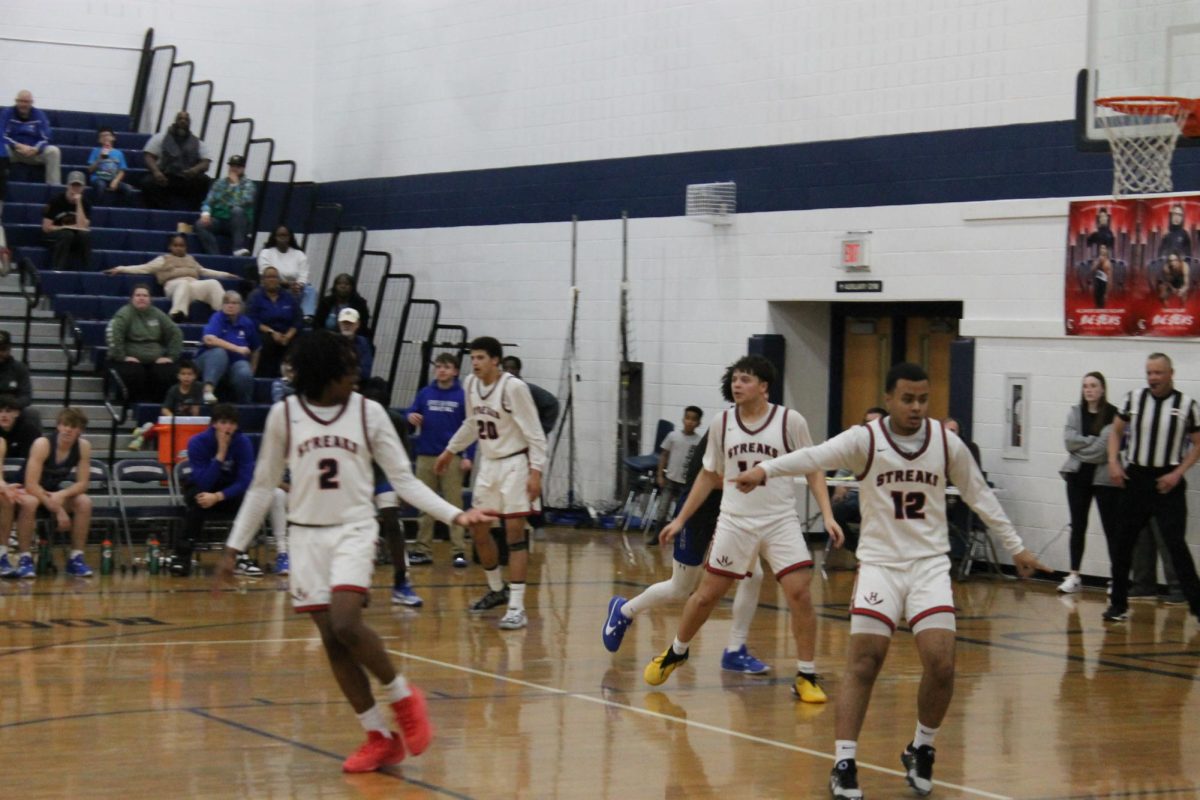 Senior Hector Rodriguez-Santiago	 informing his teammate where to go. 