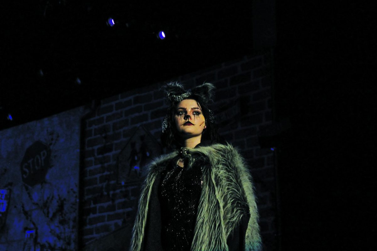 Grizabella, played by sophomore Hazel Pinnow, walks the catwalk during her performance.