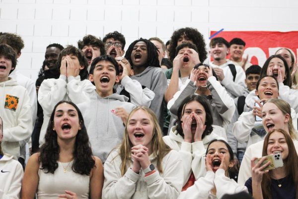 Sophomore section participates in yelling contest at pep rally. 