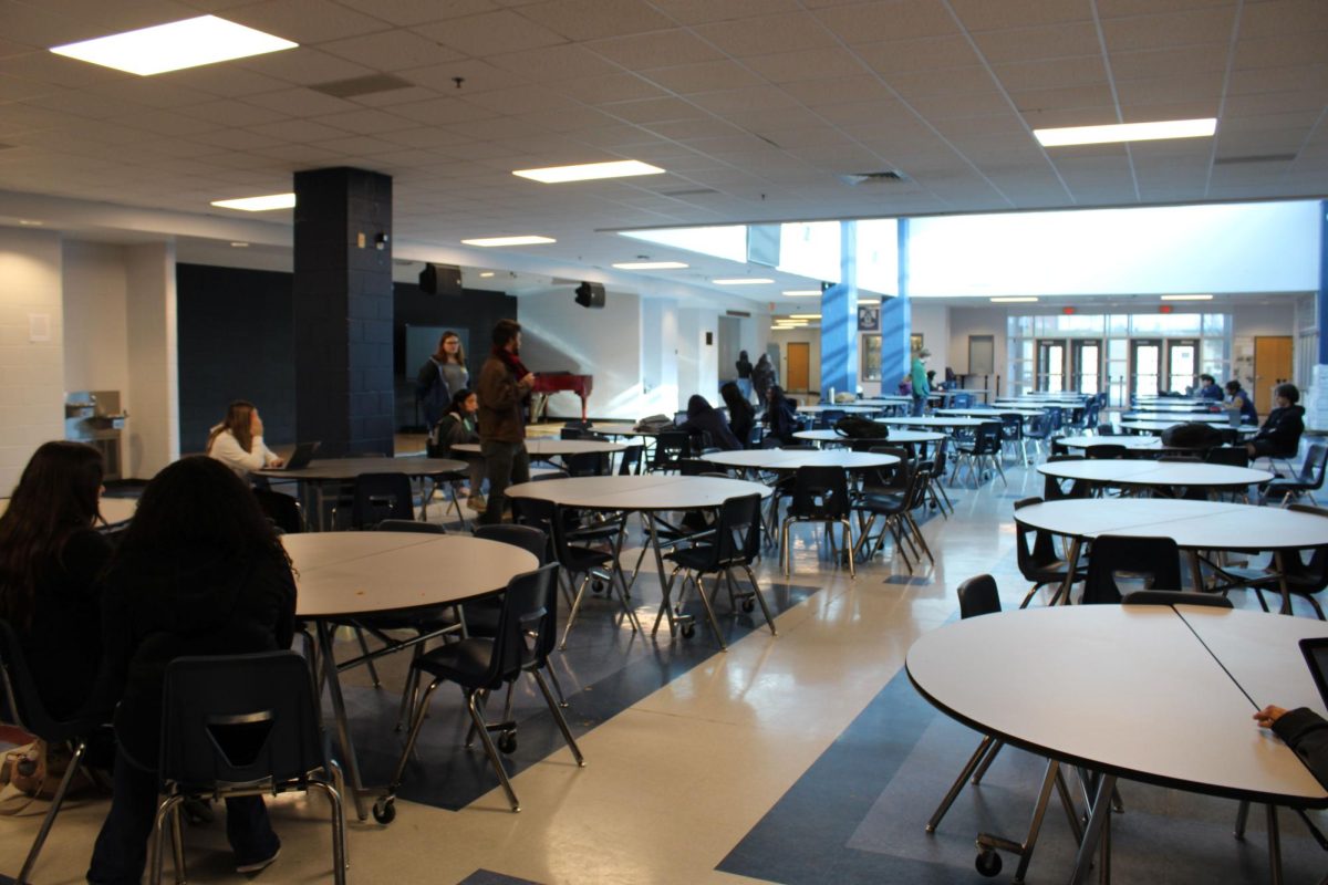 AVID Class works in gym commons to record presentations
