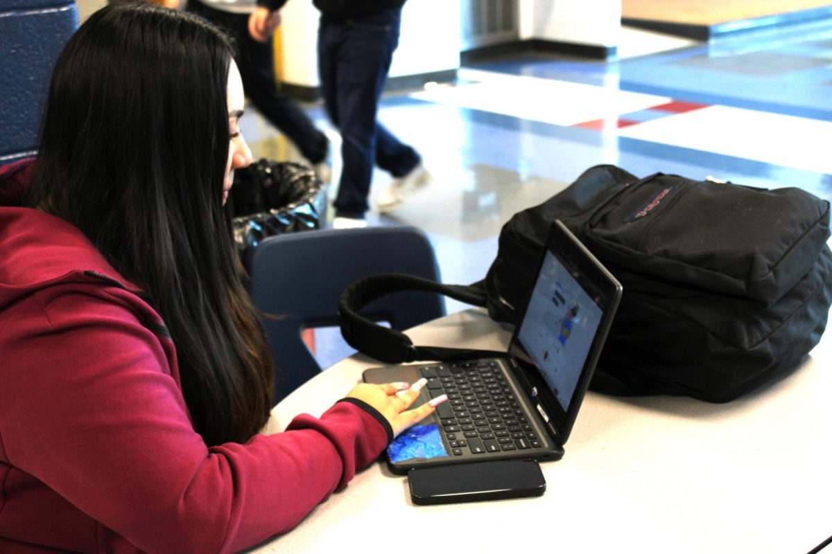 This Student is preparing her self for a presentation.