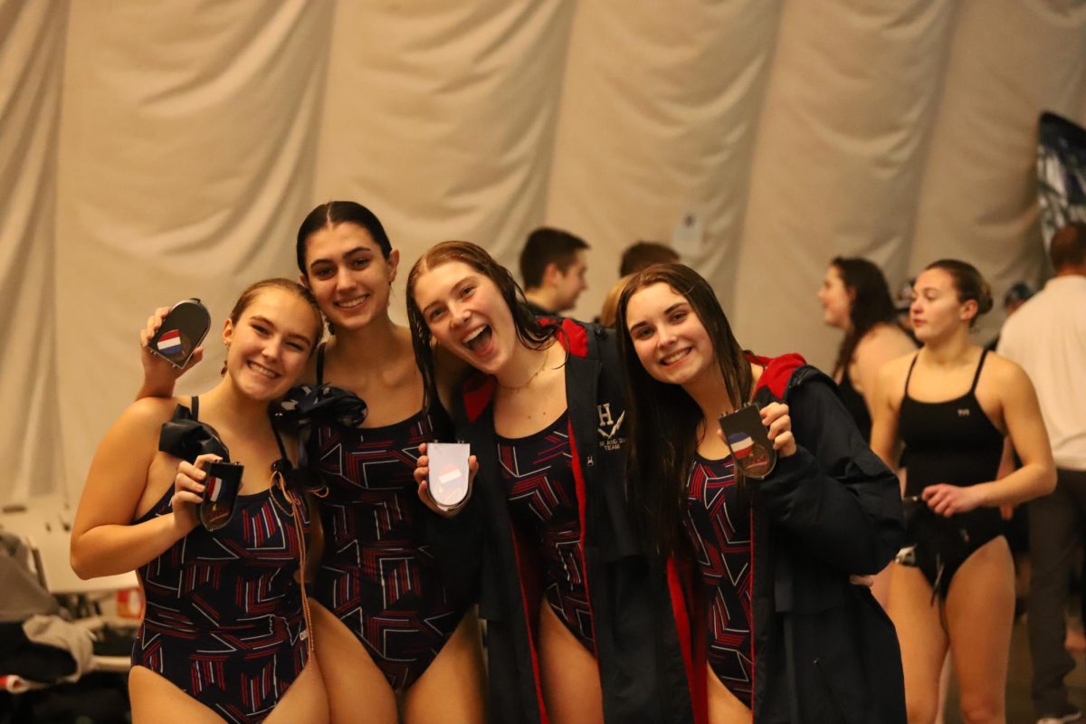 Girls swim relay team wins third place in 200 yard race.