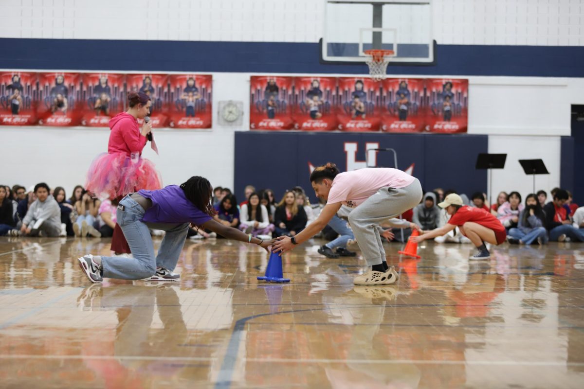 Students participate in a cone grabbing game during winter pep rally. 
