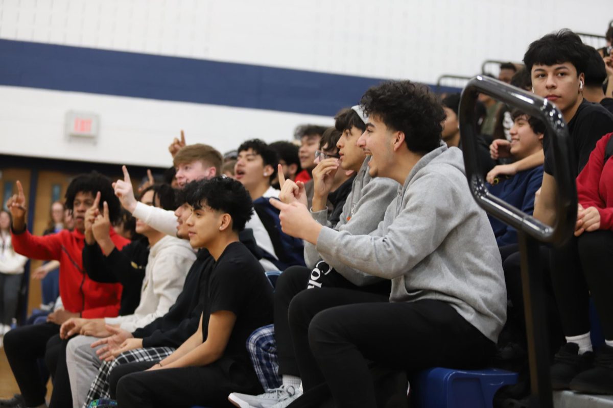 Junior class cheers for their grade in the guess the song competition. 