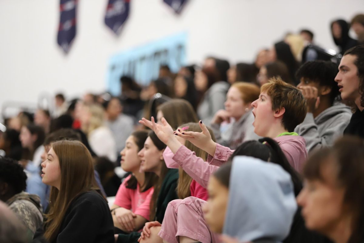 Senior class watches and participates in the guess the song competition. 