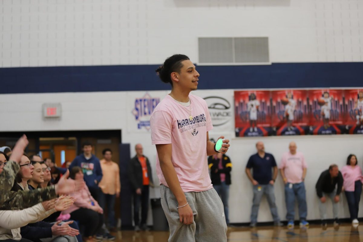 Senior Josbiel Lopez represents his class in a guess the song competition. 