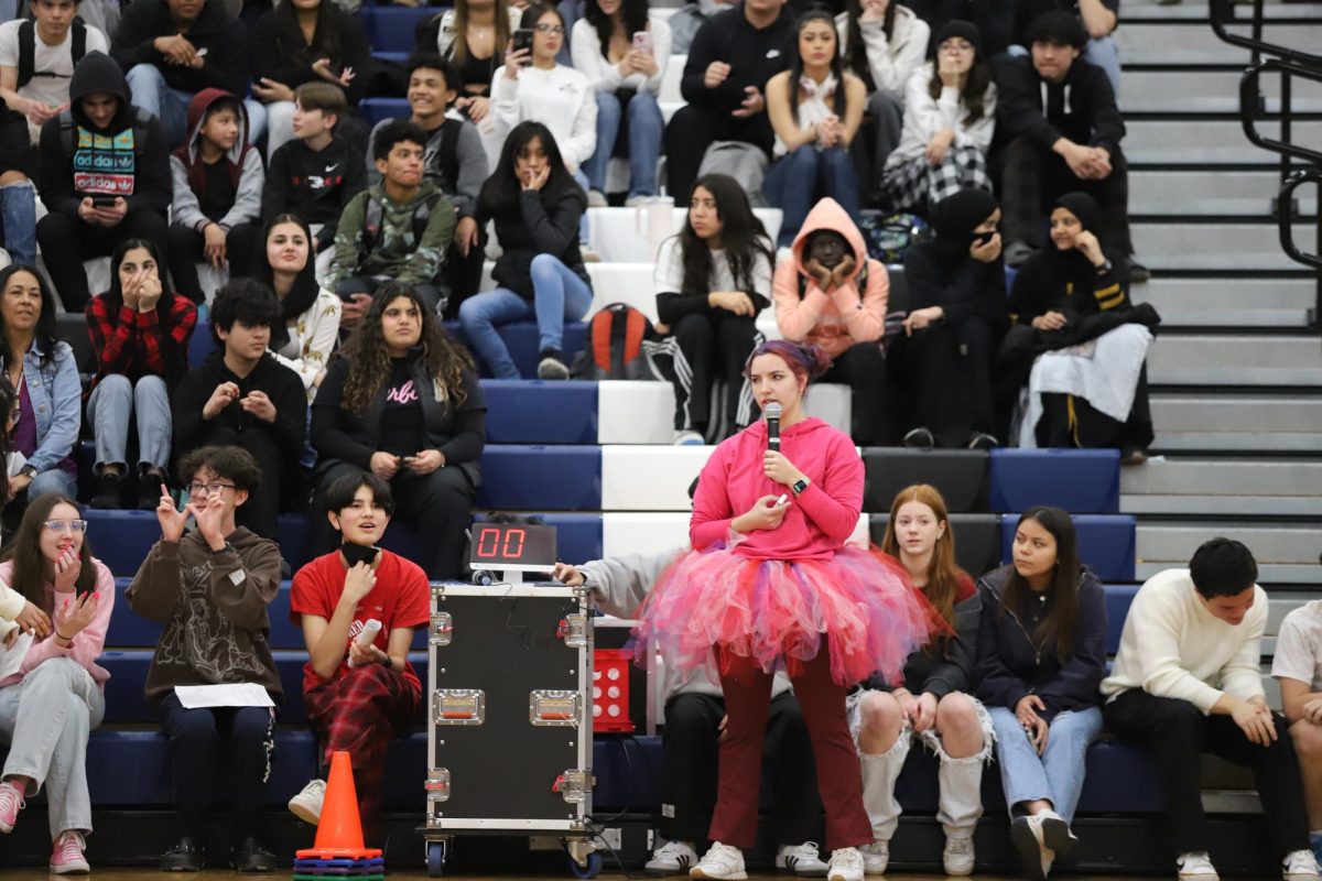 Teacher Anna Lambert runs the winter pep rally put on by SCA. 