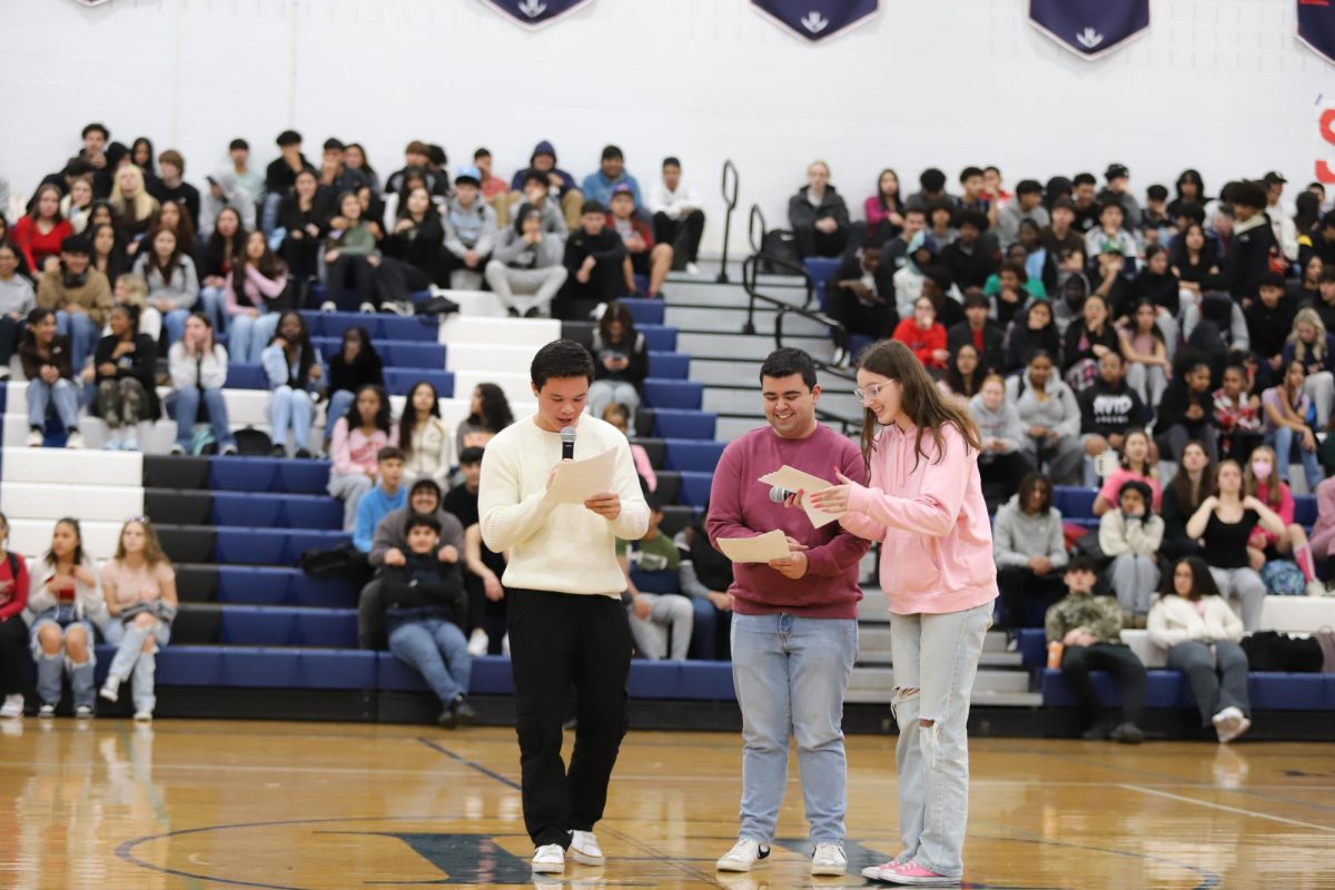 SCA representatives welcome students to the 2024 winter pep rally. 