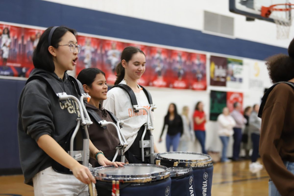 HHS marching band leads students into the gym for winter pep rally. 